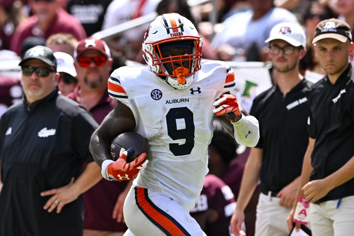 Sep 23, 2023; College Station, Texas, USA; Auburn Tigers linebacker Eugene Asante (9) recovered a fumble and ran the ball in for a touchdown during the fourth quarter against the Texas A&M Aggies at Kyle Field. Mandatory Credit: Maria Lysaker-USA TODAY Sports  